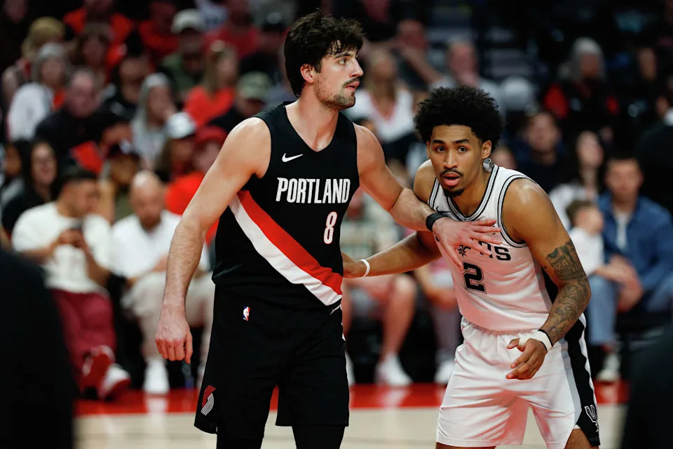 San Antonio Spurs guard Dylan Harper (2) guards Portland Trail Blazers forward Deni Avdija (8) during the second quarter of Game 4 of a first-round NBA playoff series at Moda Center on Sunday, April 26, 2026. (Sam Owens/San Antonio Express-News)