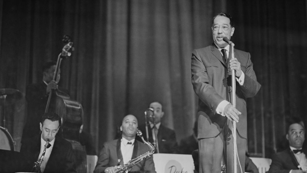 American composer, pianist and jazz musician Duke Ellington (1899-1974) pictured on stage with the Duke Ellington Orchestra at the Hammersmith Odeon in London on 14th January 1963. (Photo by McCabe/Daily Express/Hulton Archive/Getty Images)