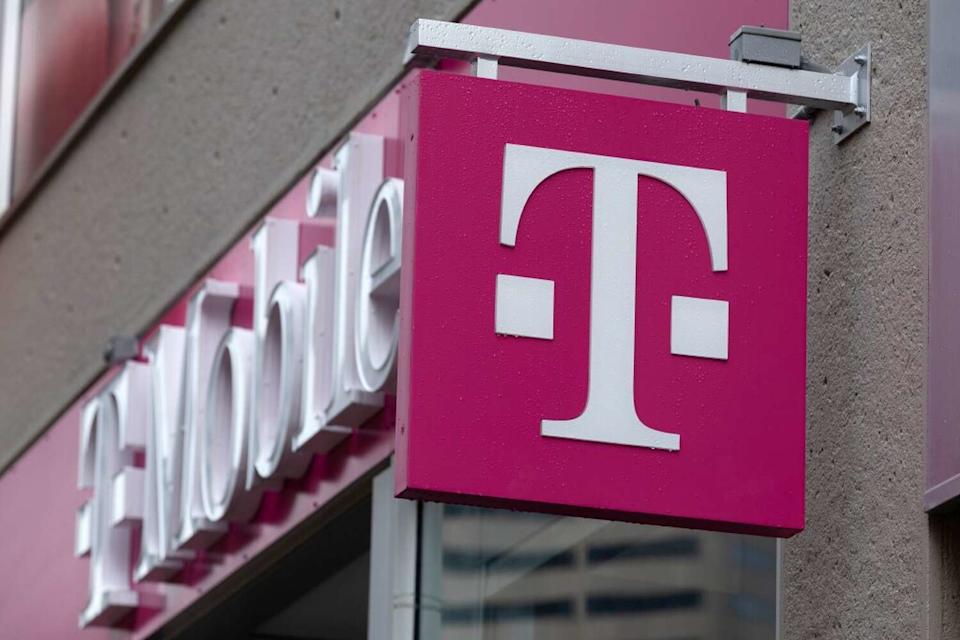 The T-Mobile logo is seen on a storefront, on Oct. 14, 2022, in Boston. The wireless carrier recently notified state officials it plans to cut 75 jobs in Austin. (Associated Press file photo)