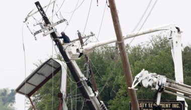 A lineman works to repair a damaged power pole after severe weather hit the area, Sunday, April 26, 2026, in Springtown, Texas. (Elías Valverde II/The Dallas Morning News via AP)