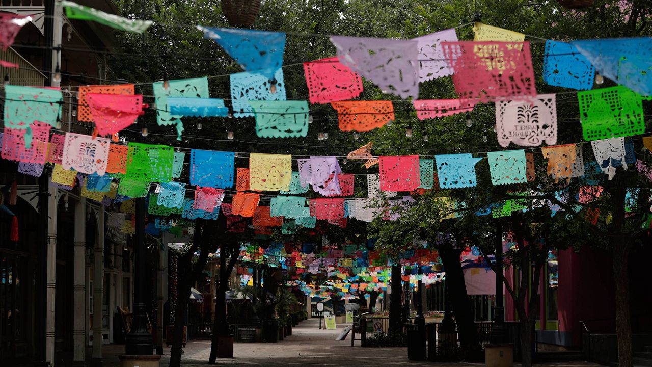 Papel picado decorates a closed Market Square in downtown San Antonio, Thursday, April 16, 2020. (AP Photo/Eric Gay)