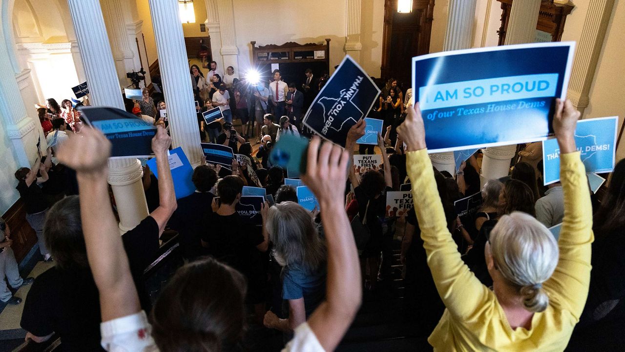 Supporters for the returning Texas Democrats chant as members enter the house at the Texas Capitol in Austin, Texas, Monday, Aug. 18, 2025. (AP Photo/Stephen Spillman)