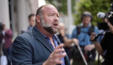 Right-wing conspiracy theorist Alex Jones speaks to the media after arriving at the federal courthouse for a hearing in front of a bankruptcy judge, Friday, June 14, 2024, in Houston. (AP Photo/David J. Phillip, File)