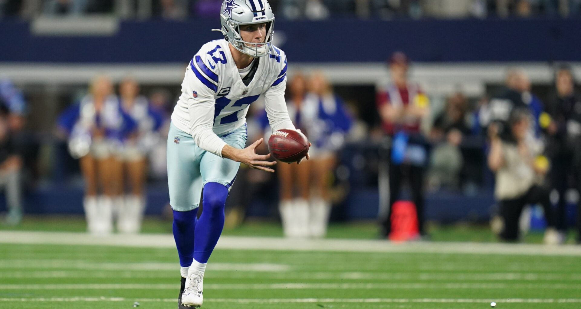 Dec 14, 2025; Arlington, Texas, USA; Dallas Cowboys place kicker Brandon Aubrey (17) runs a fake field goal during the first half against the Minnesota Vikings at AT&T Stadium.