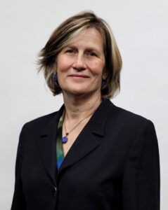 headshot of woman wearing black blazer