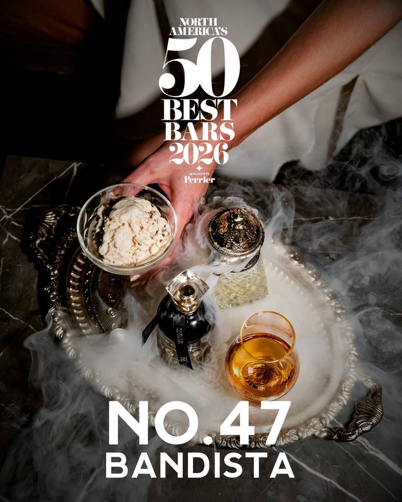 Image shows a cocktail served in a tray of smoke with No. 47. 