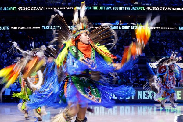The Dallas Mavericks hosted Native American Night on March 1, featuring Choctaw Nation dancers performing during halftime at the game against the Oklahoma City Thunder at American Airlines Center. Above the dancers are words beckoning visitors to the casino, 90 miles north of downtown Dallas in Durant.