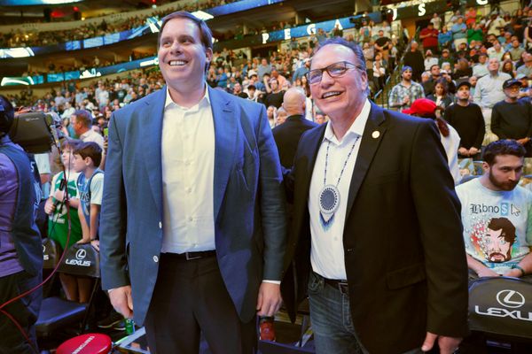 Patrick Dumont (left), chief operating officer of Sands Corp. and governor of the Mavs, and Gary Batton, chief of the Choctaw Nation of Oklahoma, stood courtside at the start of the game against Oklahoma City on March 1. Batton says the tribe considers North Texas an extension of its reservation.