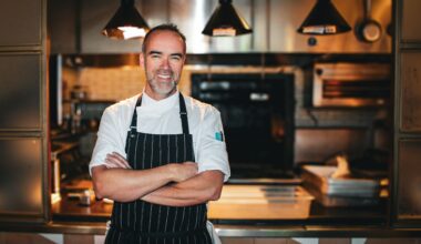 Chef Toby Archibald stands in front of his kitchen at Quarter Acre.
