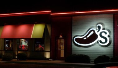 A Chili's restaurant logo stands lit in El Paso, Tex., Wednesday, Oct. 23, 2019. (AP Photo/Rogelio V. Solis)