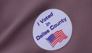A primary voter wears a sticker after casting a ballot at a voting center in Dallas, Tuesday, March 3, 2026. (AP Photo/LM Otero)