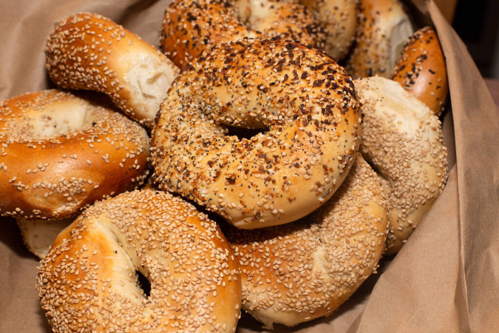 Image shows a bag full of bagels.