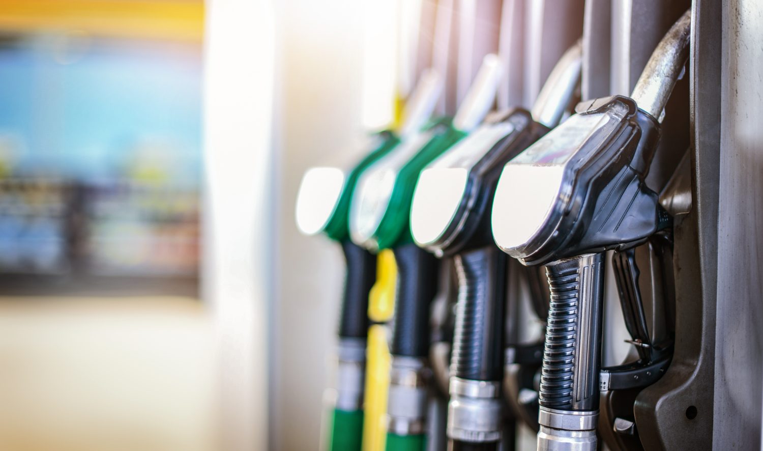 Gas pump handles at a gas station