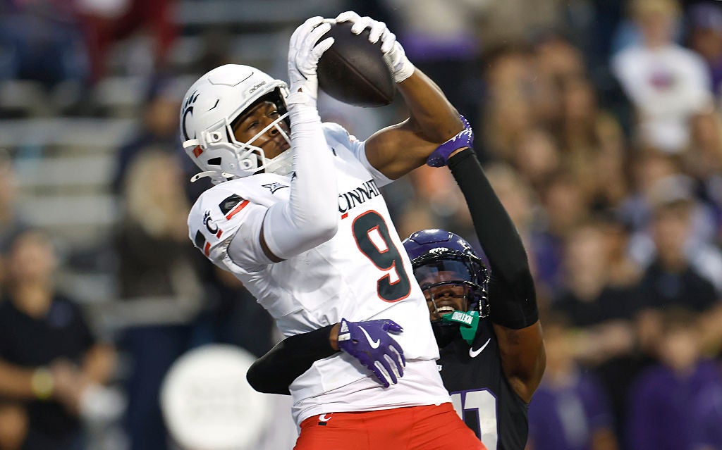 FORT WORTH, TEXAS - NOVEMBER 29: Jeff Caldwell #9 of the Cincinnati Bearcats catches a touchdown pass as Jevon McIver Jr. #20 of the TCU Horned Frogs defends during the first half at Amon G. Carter Stadium on November 29, 2025 in Fort Worth, Texas. (Photo by Ron Jenkins/Getty Images)