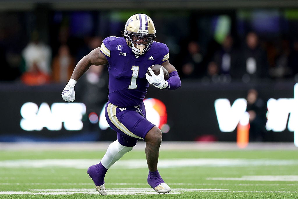 SEATTLE, WASHINGTON - NOVEMBER 29: Jonah Coleman #1 of the Washington Huskies carries the ball against the Oregon Ducks at Husky Stadium on November 29, 2025 in Seattle, Washington. (Photo by Steph Chambers/Getty Images)