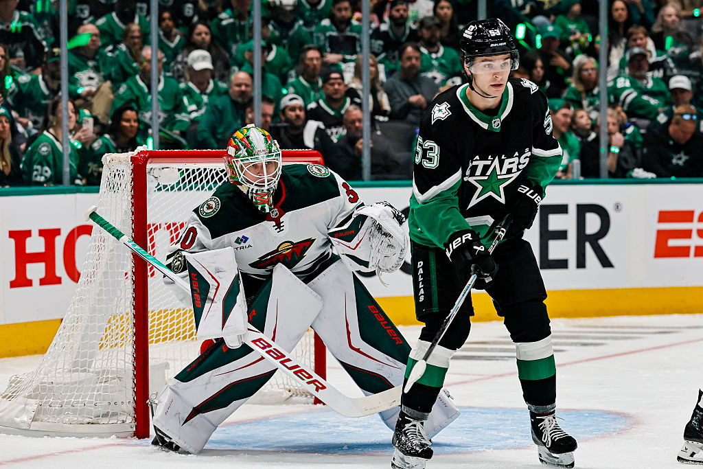 DALLAS, TX - APRIL 18: Dallas Stars center Wyatt Johnston (53) sets up in front of Minnesota Wild goaltender Jesper Wallstedt (30) during the Stanley Cup Playoffs First Round game 1 between the Dallas Stars and the Minnesota Wild on April 18, 2026 at American Airlines Center in Dallas, TX. (Photo by Matthew Pearce/Icon Sportswire via Getty Images)
