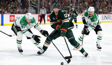 ST PAUL, MINNESOTA - APRIL 22: Matt Boldy #12 of the Minnesota Wild skates with the puck against Tyler Myers #57 and Sam Steel #18 of the Dallas Stars in the second period of Game Three of the First Round of the 2026 Stanley Cup Playoffs at Grand Casino Arena on April 22, 2026 in St Paul, Minnesota. (Photo by David Berding/Getty Images)