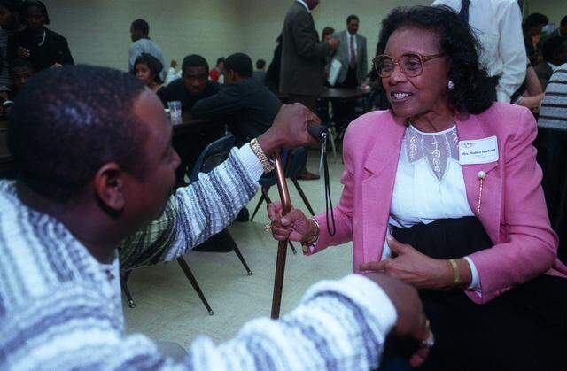 Feb. 2, 1999: Mrs. Walter B. Barbour, right, the first African-American female to serve on the Fort Worth City Council (1977-1979), talks with Delta May Jr., a Fort Worth resident, during a special reception honoring past Black City Council members at Dunbar High School.