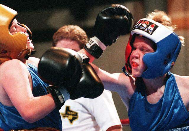 Feb. 25, 1999: Crunch Corner Boxing Club's Austin Hull (right) exchanges punches with Shawn Dutton (left) of Saginaw Boxing Club during the Golden Gloves Tournament at the John Justin Arena in Fort Worth. Hull lost the match.