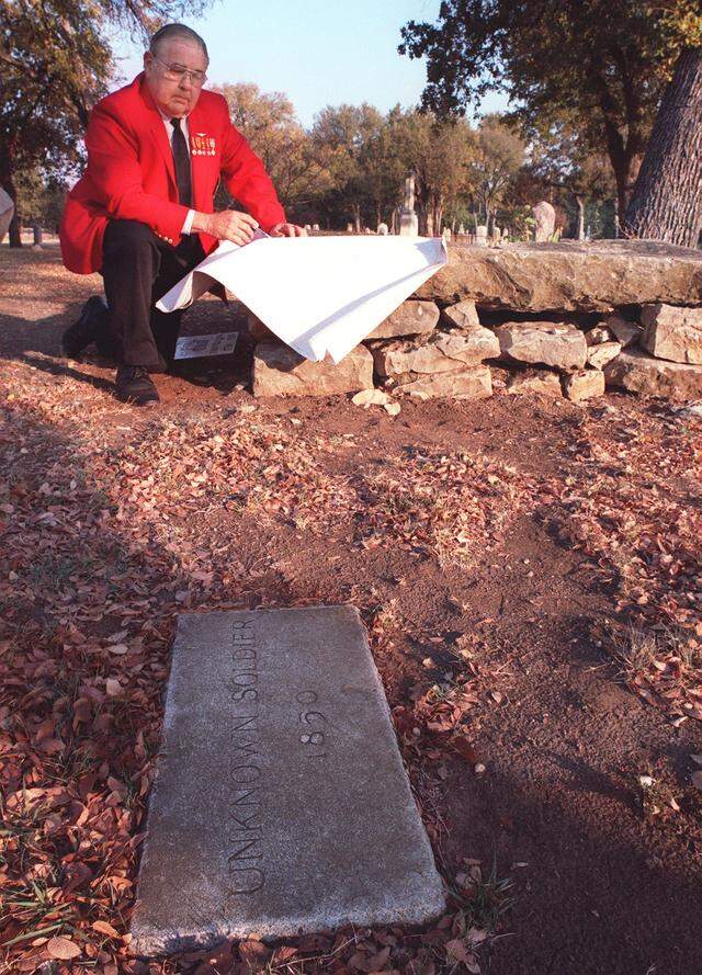 Oct. 29, 1999: Willard Thomas, Vice-President of the Tarrant County Veterans Council, looks over the headstone of one of the unknown soldiers stationed in Fort Worth who died in 1850, buried in Pioneer's Rest Cemetery. The names of the soldiers have been found through medical records in the National Archives, though which ones are in which grave is unknown. There are 11 unknown soldiers buried in the cemetery.