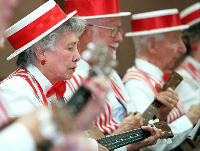 Rosemary Slusser and members of the Ukelele Band perform during an anniversary party at the Senior Recreation Center Monday, 10/26/99. (Bobby Ornelas/Special to Star telegram)