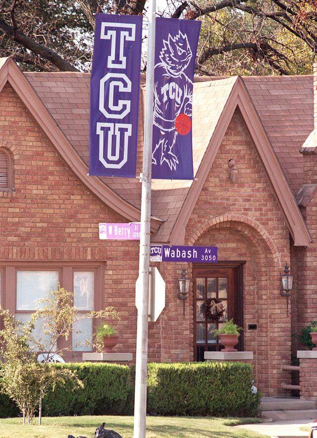 Texas Christian University is trying to improve it's relationship with the neighborhood which it is surrounded by. The TCU banners line Berry St. in front of a home on the corner of Wabash Ave., one block from the edge of campus. Nov 30, 1999 Fort Worth Star-Telegram photo by Ron T. Ennis