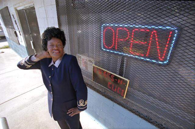Dec. 20, 1999: Idar Wilkinson strikes a pose in front of her beauty shop, Ida's Fashionaire Beauty Salon, in Stop Six. The 63-year-old was closing after 46 years. “I thank God for every one of those years,” she said.