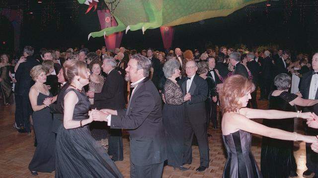 Jan. 9, 1999: Jewel Charity Ball attendees dance under the Emerald Dragon at the Amon Carter Jr. Exhibits Hall. The Emerald Dragon was later sold to a high school for a mascot.