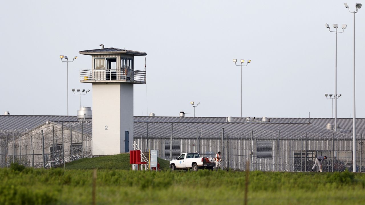 An inmate works outdoors during the hot summer outside a Texas prison unit in Huntsville, Texas, on June 25, 2015. (Rose Baca/The Dallas Morning News via AP, File)