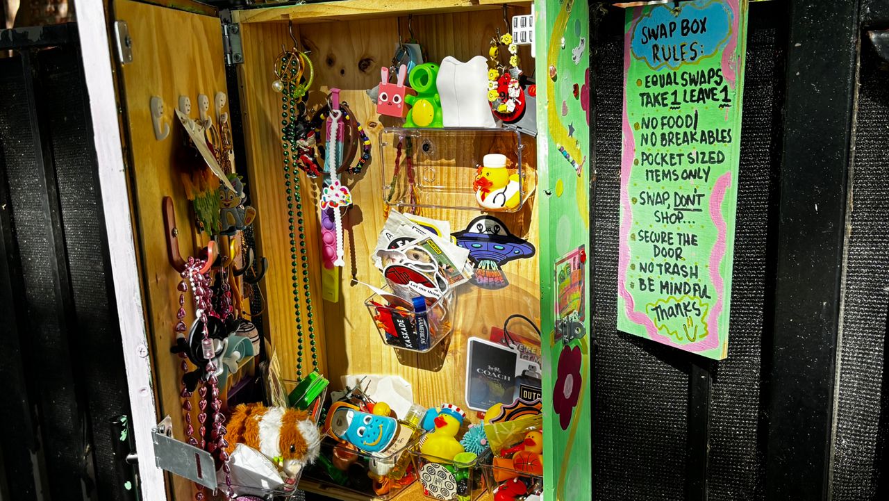 Anna Arocha's trinket trade box is located in The Triangle neighborhood of downtown Austin. (Spectrum News 1/Hannah Maguire)