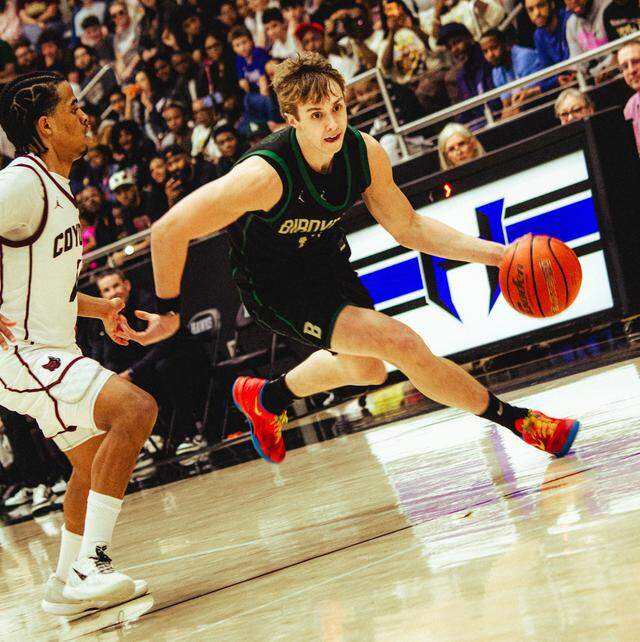 Birdville’s Avery Webb dribbles around a Frisco Heritage defender in a Class 5A Division I state semifinal March 10 at Hebron High School in Carrollton.