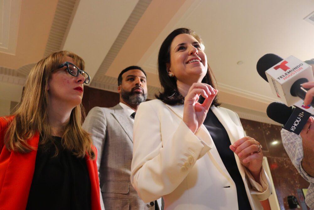 Council member Alejandra Salinas, right, speaks to reporters with Abbie Kamin and Edward Pollard after an HPD-ICE policy change passed on Apr. 8., 2026.