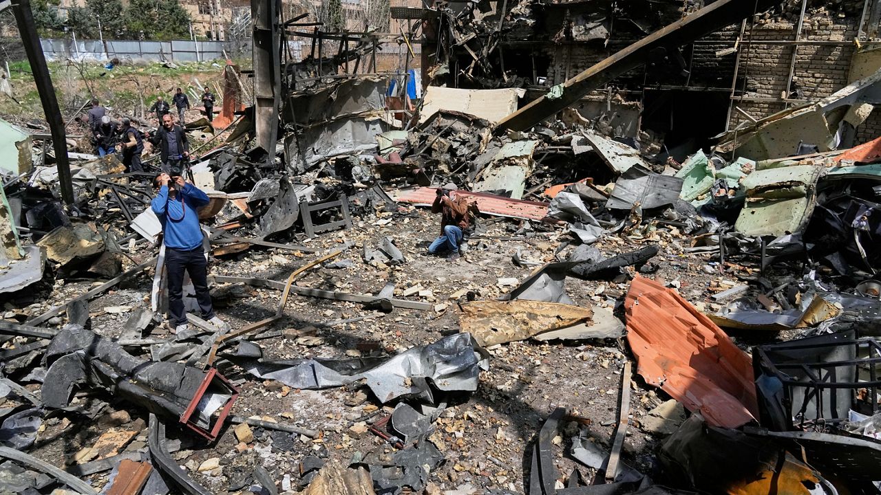 Photographers document damage from U.S.-Israeli airstrikes Friday at Shahid Beheshti University in Tehran, Iran, Saturday, April 4, 2026. (AP Photo/Vahid Salemi)