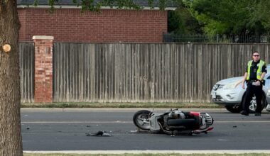 Motorcycle rider injured in crash at 98th & Slide