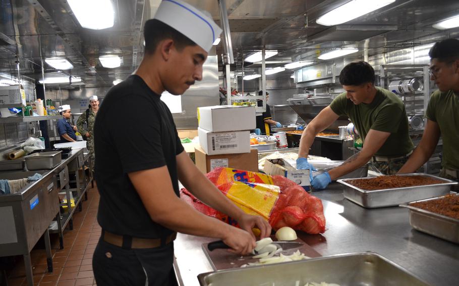 Lopez with knife in hand.