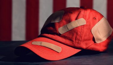 MAGA hat with bandages on it
