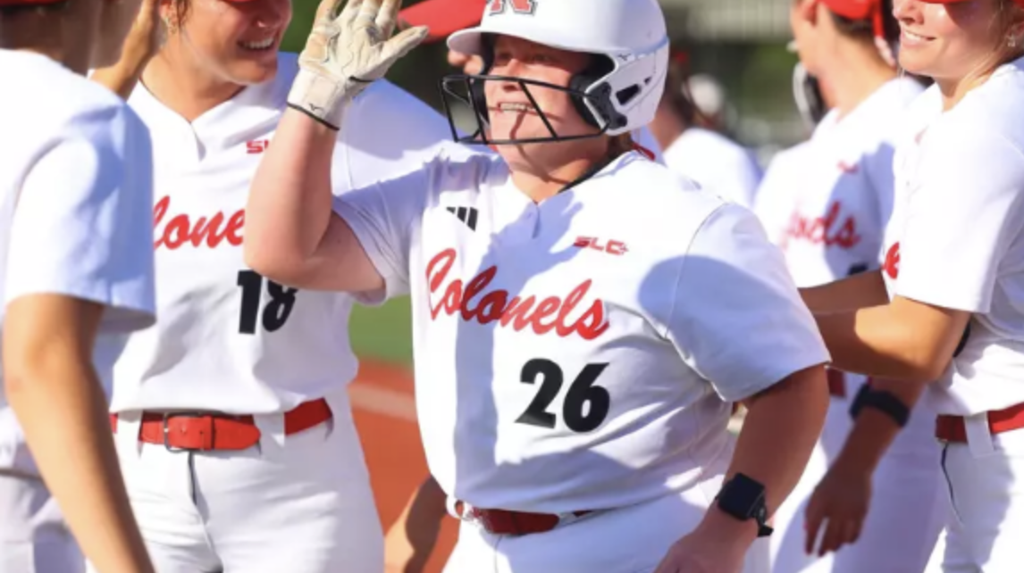 Brynne Songy (26) celebrating with the Nicholls softball team. (Photo via: Nicholls Athletics).