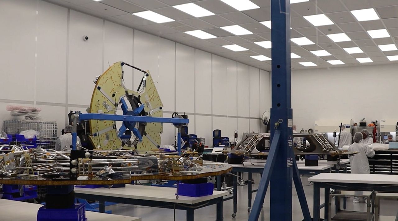 Firefly Aerospace employees working on a two-part spacecraft designed to explore the far side of the moon. (Spectrum News 1/Andres Rendon)