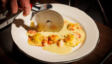 The Snow Crab 6 Pack at The Charles is a ravioli cut tableside. (Photo by Samantha Marie Photography)