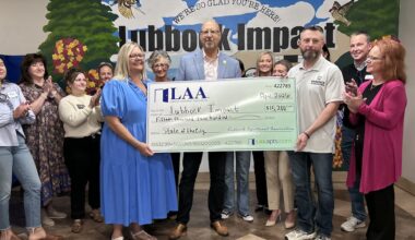 Lubbock Apartment Association presents $15,200 check to Lubbock Impact