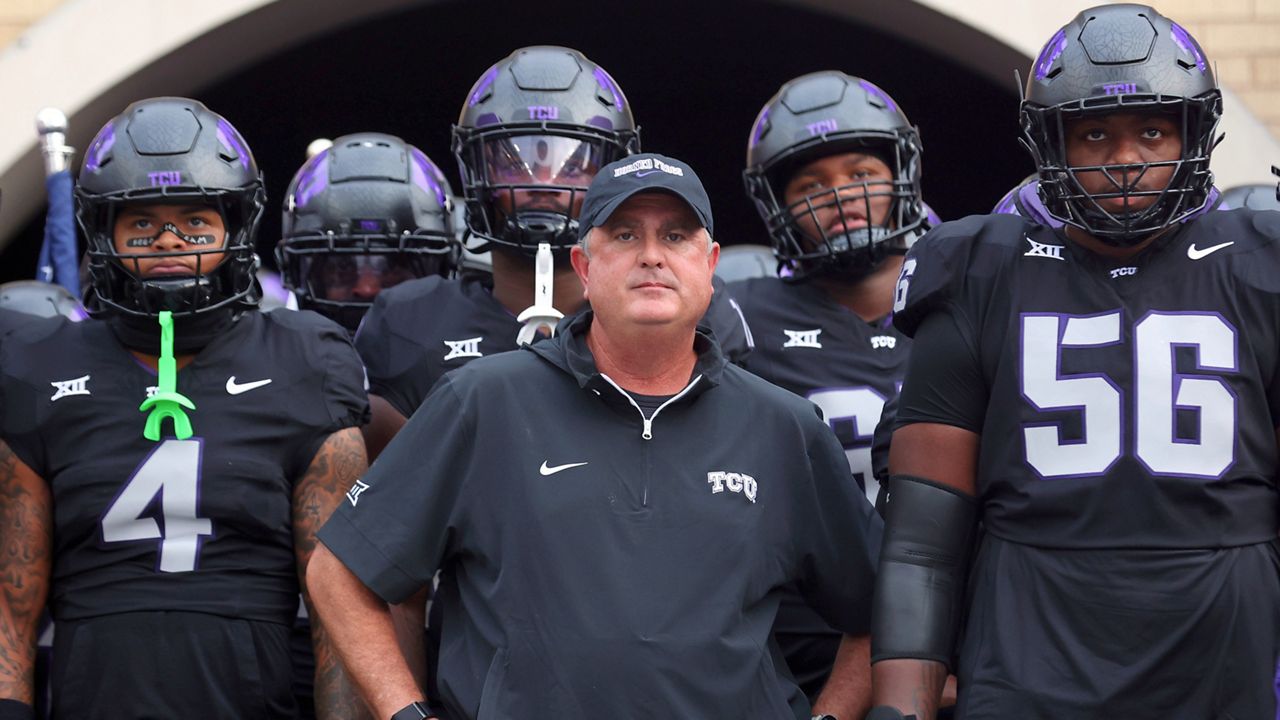 TCU head coach Sonny Dykes, center, waits with the team to run out of the tunnel before the game against Central Florida in an NCAA college football game Saturday, Sept. 14, 2024, in Fort Worth, Texas. (AP Photo/Richard W. Rodriguez, File)