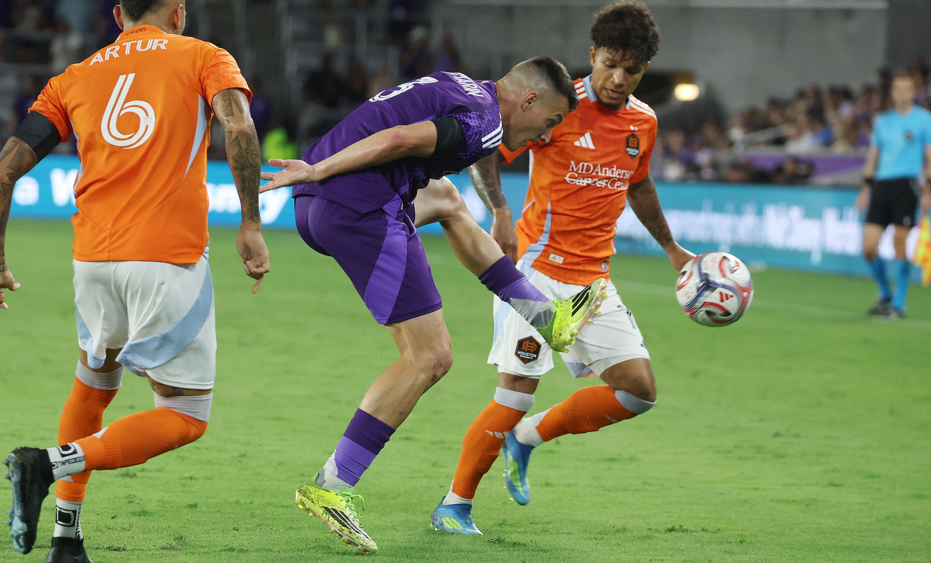 Orlando player Adrian Marin (3) kicks in front of Houston...