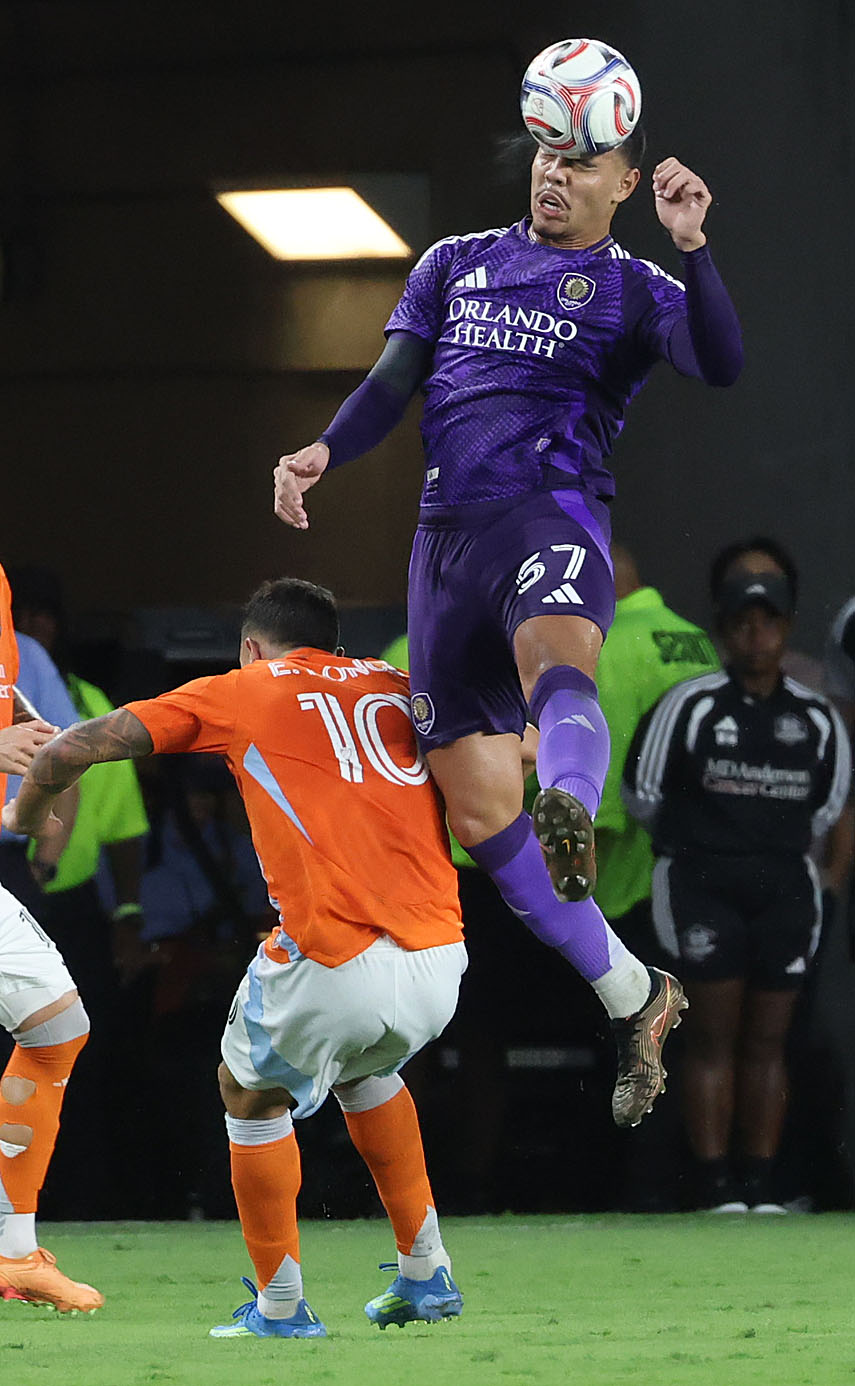 Orlando player Iago Teodoro (57) heads the ball over Houston...