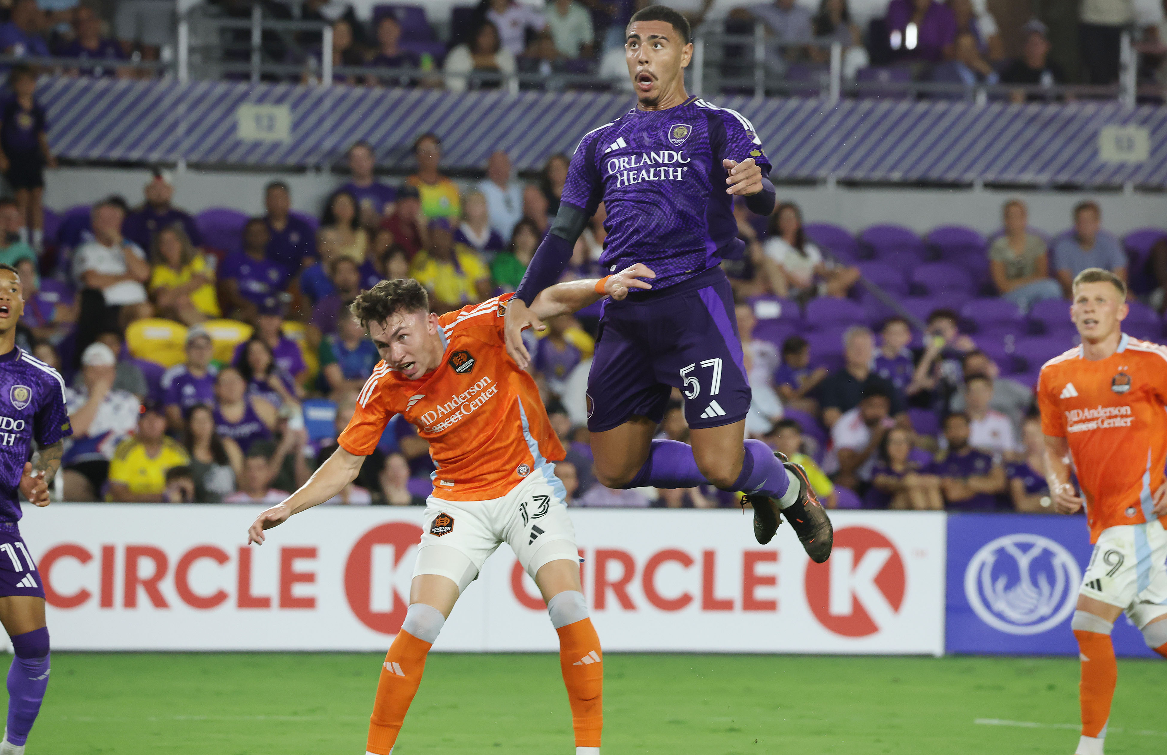 Orlando player Iago Teodoro (57) leaps over Houston player Sam...