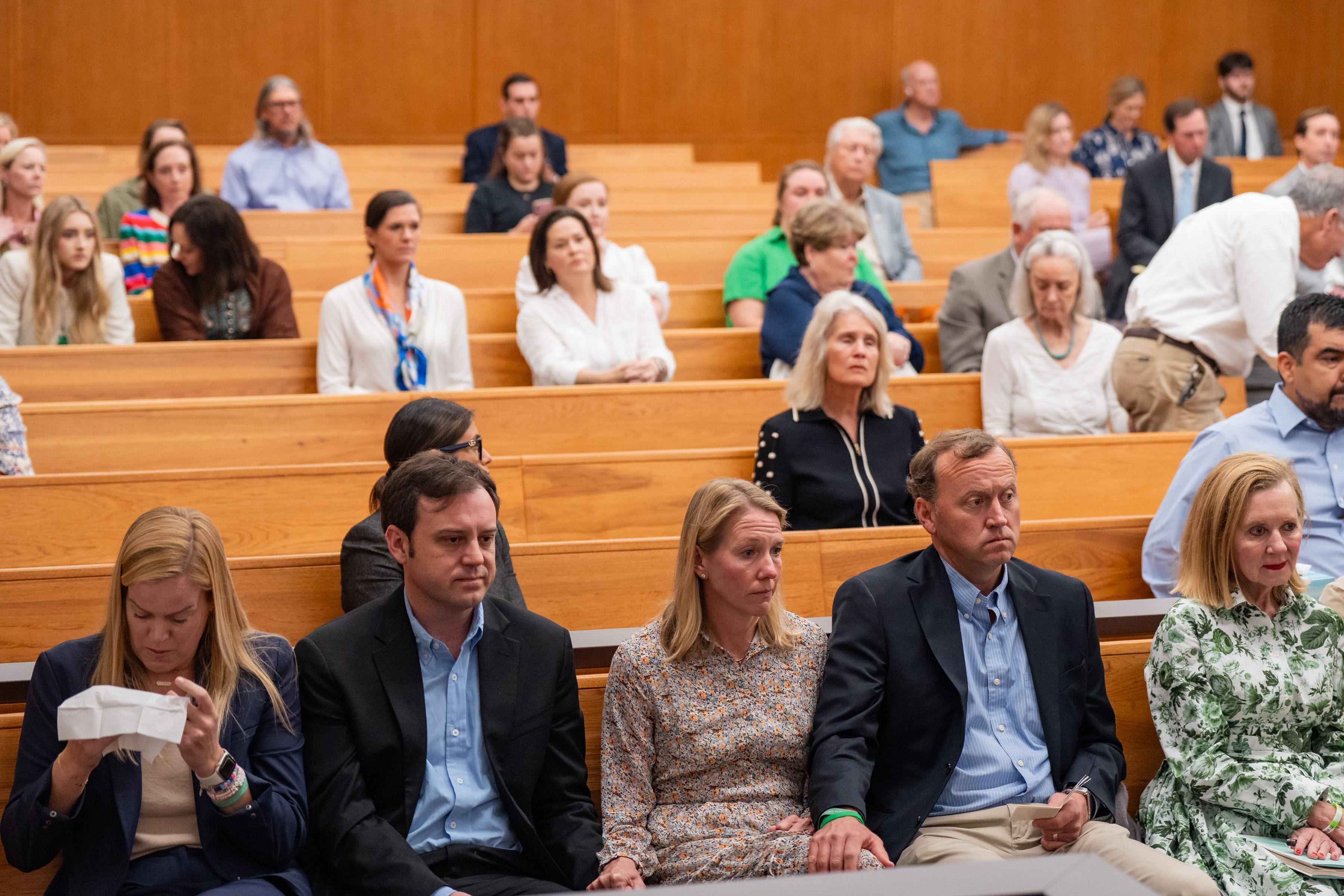 The Eastland family sits together as they attend a hearing...