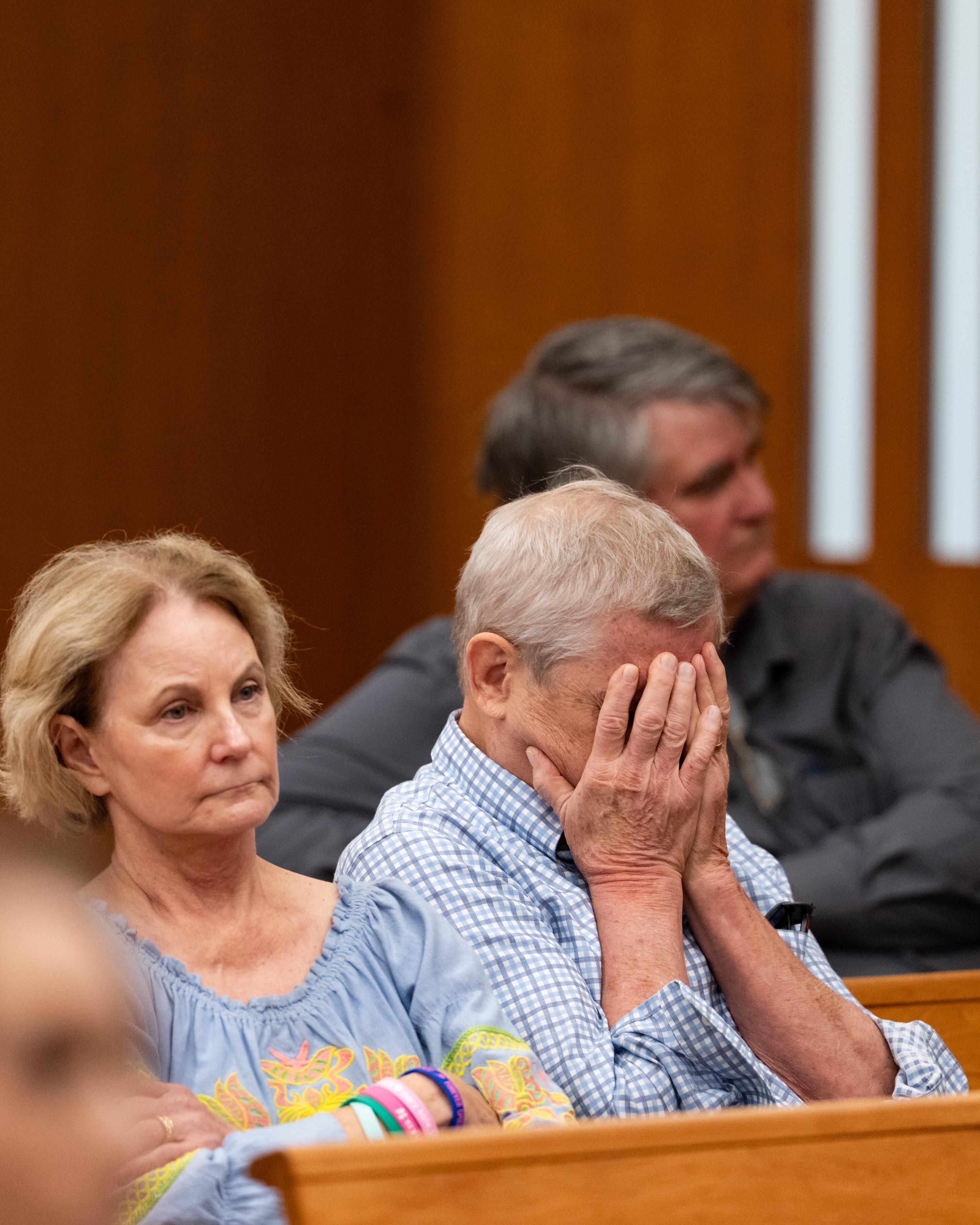 Members of the gallery listen to testimony during a hearing...