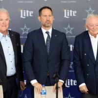 Jan 27, 2025; Frisco, TX, USA; (L to R) Dallas Cowboys CEO Stephen Jones, head coach Brian Schottenheimer and owner Jerry Jones pose for pictures after a press conference at the Star.