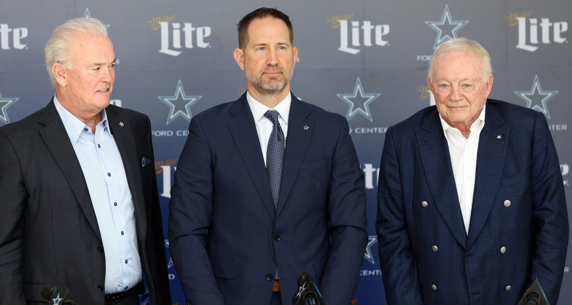 Jan 27, 2025; Frisco, TX, USA; (L to R) Dallas Cowboys CEO Stephen Jones,head coach Brian Schottenheimer and owner Jerry Jones pose for pictures after a press conference at the Star.