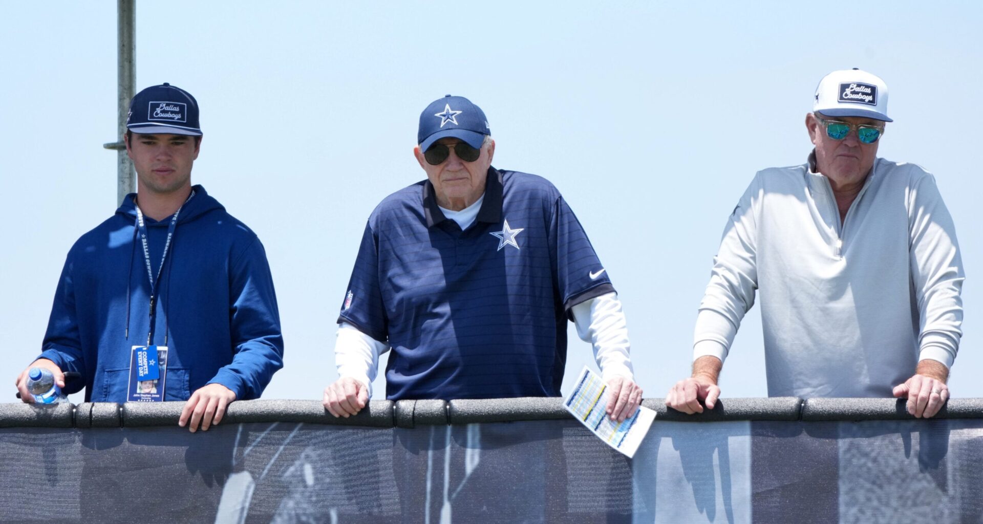 Jul 22, 2025; Oxnard, CA, USA; Dallas Cowboys owner Jerry Jones (center) watches with grandson John Stephen Jones (left) and son Stephen Jones during training camp at the River Ridge Fields.