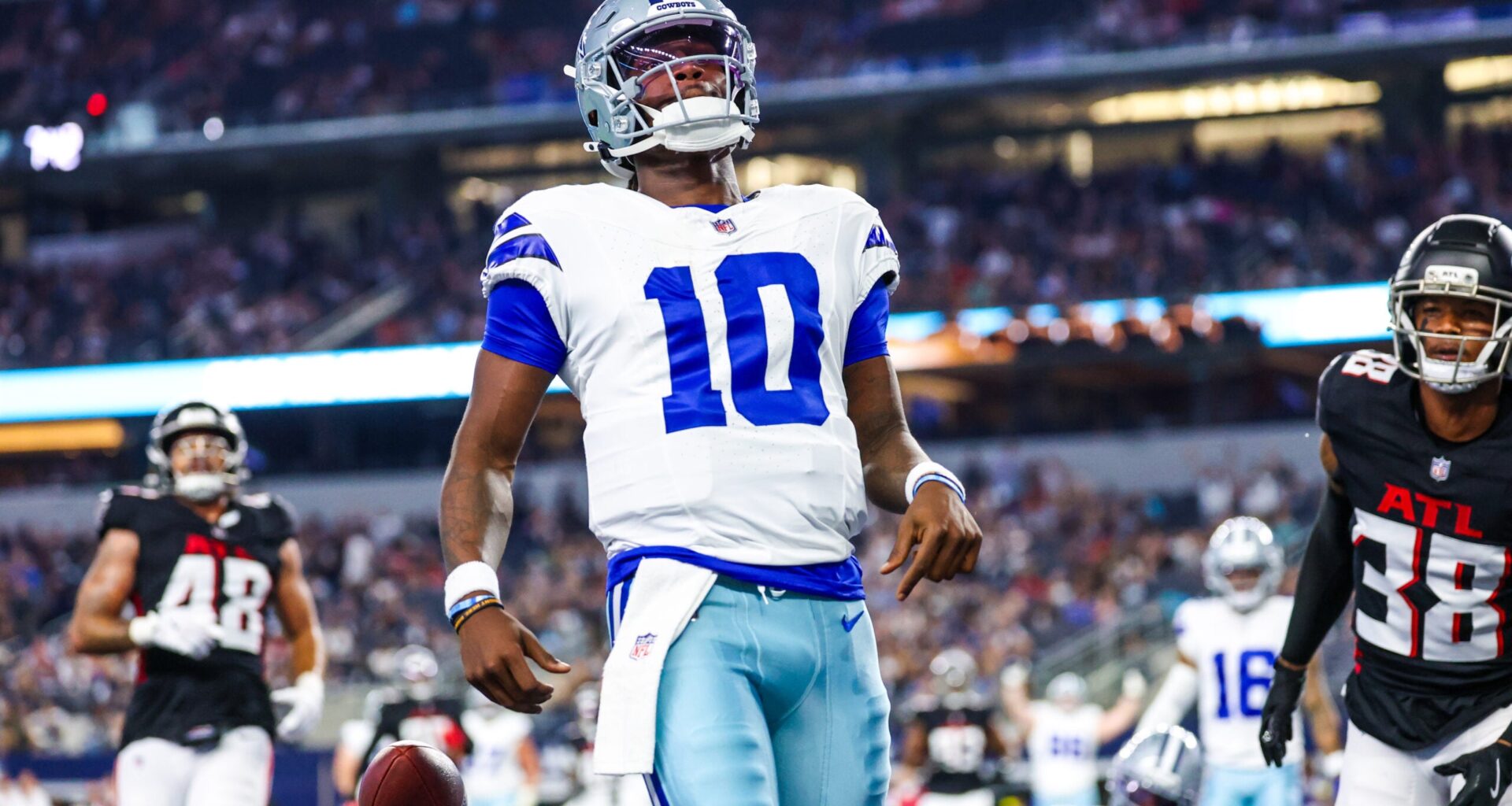 Aug 22, 2025; Arlington, Texas, USA; Dallas Cowboys quarterback Joe Milton III (10) reacts after scoring a touchdown during the first quarter against the Atlanta Falcons at AT&T Stadium.